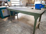 an image of a table with a conveyor belt in a factory