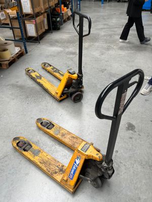 two pallets that are sitting on the floor in a warehouse