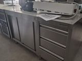 a large kitchen with stainless steel cabinets and a counter top
