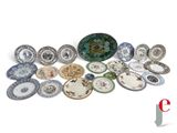 a lot of plates that are sitting on a table