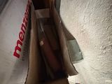 a box with a hot dog inside of it sitting on the floor
