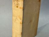 an old book with a piece of paper sticking out of it