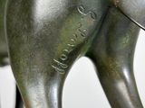 a statue of an elephant that is standing on a table