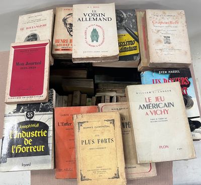 many books stacked on top of each other on a table