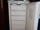 an image of a kitchen with a refrigerator in it