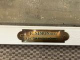 a close up of a brass plate on a door handle