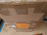 a box and a saw on the floor next to a box