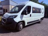 a white van that is parked on the side of the road