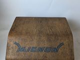 a small wooden box with a name on it