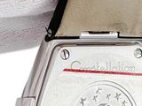 a close up of a watch on a white surface