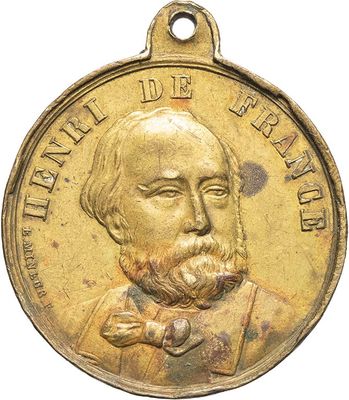 an old gold medal of a man with a beard and a bow tie