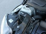 a car engine that is under the hood of a motorcycle