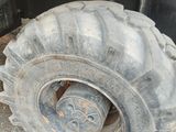a large tire on the back of a truck