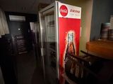 an image of a coca cola machine in a room