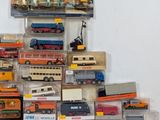 many different types of toy trains and trucks on display