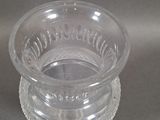 a clear glass bowl on top of a clear plate