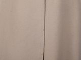 a close up of a woman ' s skirt with buttons on the side