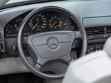 dashboard of a car with a steering wheel and dashboard gauges