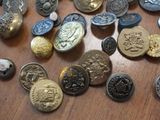 a lot of buttons that are on a table