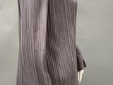 an image of a mannequin mannequin wearing a gray and black striped jacket