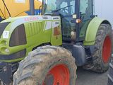 a tractor that is parked next to a building