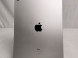 an apple ipad sitting on top of a white table next to a white wall