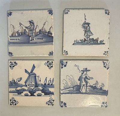 four blue and white tile paintings of a man and a woman on a boat