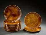a stack of plates with a fish design on them