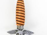 an image of a close up of a sword with an eagle on it