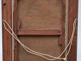 a picture of an old wooden frame with a rope on it