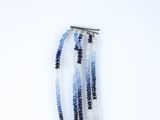 three strands of blue and white glass beads with a silver clasp
