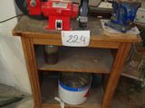 a small table with a red machine on top of it