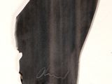 a black piece of paper with a drawing of a man ' s face on it