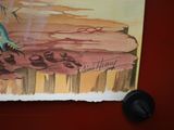 a picture of a painting of a dinosaur on the wall