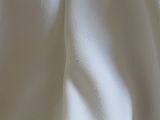 a close up of a white shirt with a black tie