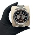 someone is holding a wrist watch in their hand on a white background