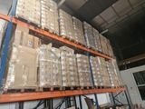 a large amount of boxes stacked on a pallet in a warehouse