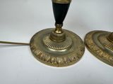 two lamps that are sitting on a white table