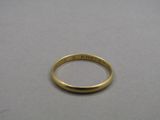 a close up of a gold ring on a table
