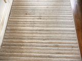a rug on the floor next to a door