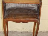 a small wooden table with a shelf on top of it