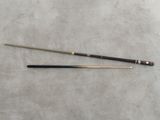 an old snooker cue and a cue stick laying on a table