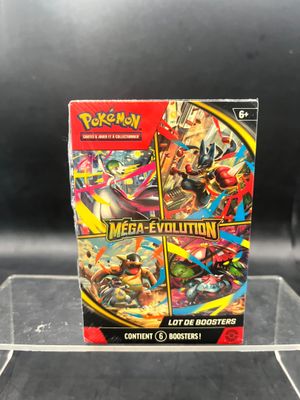a box of pokemon mega evolutions cards on display