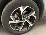 a close up of a tire on a car ' s rim