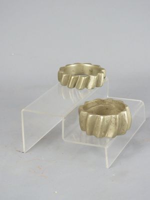 pair of gold plated candle holders on clear acrylic stands