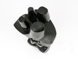 black and white photograph of a sculpture of a hand holding a ball
