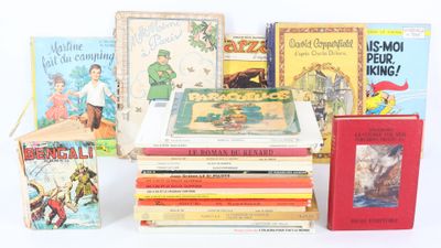 plusieurs livres pour enfants empilés sur une surface blanche