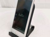 a cell phone that is sitting on top of a stand