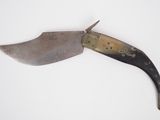 a knife that is laying on top of a table