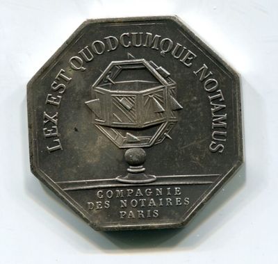 the back of a silver coin with a picture of a plane on it